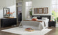 Danziar Queen Panel Headboard with Mirrored Dresser, Chest and Nightstand