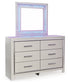 Zyniden Queen Upholstered Panel Bed with Mirrored Dresser and Chest