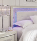 Zyniden Queen Upholstered Panel Headboard with Mirrored Dresser, Chest and Nightstand